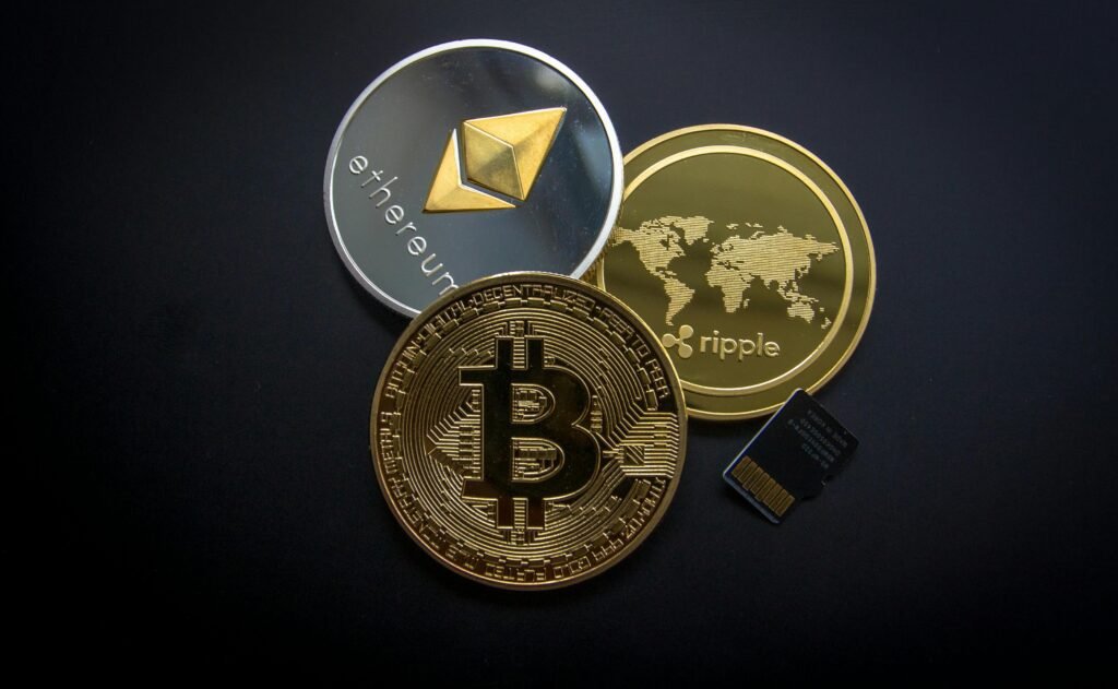 pexels-photo-844124-844124 A striking image of Bitcoin, Ethereum, and Ripple coins illustrating modern digital currency.